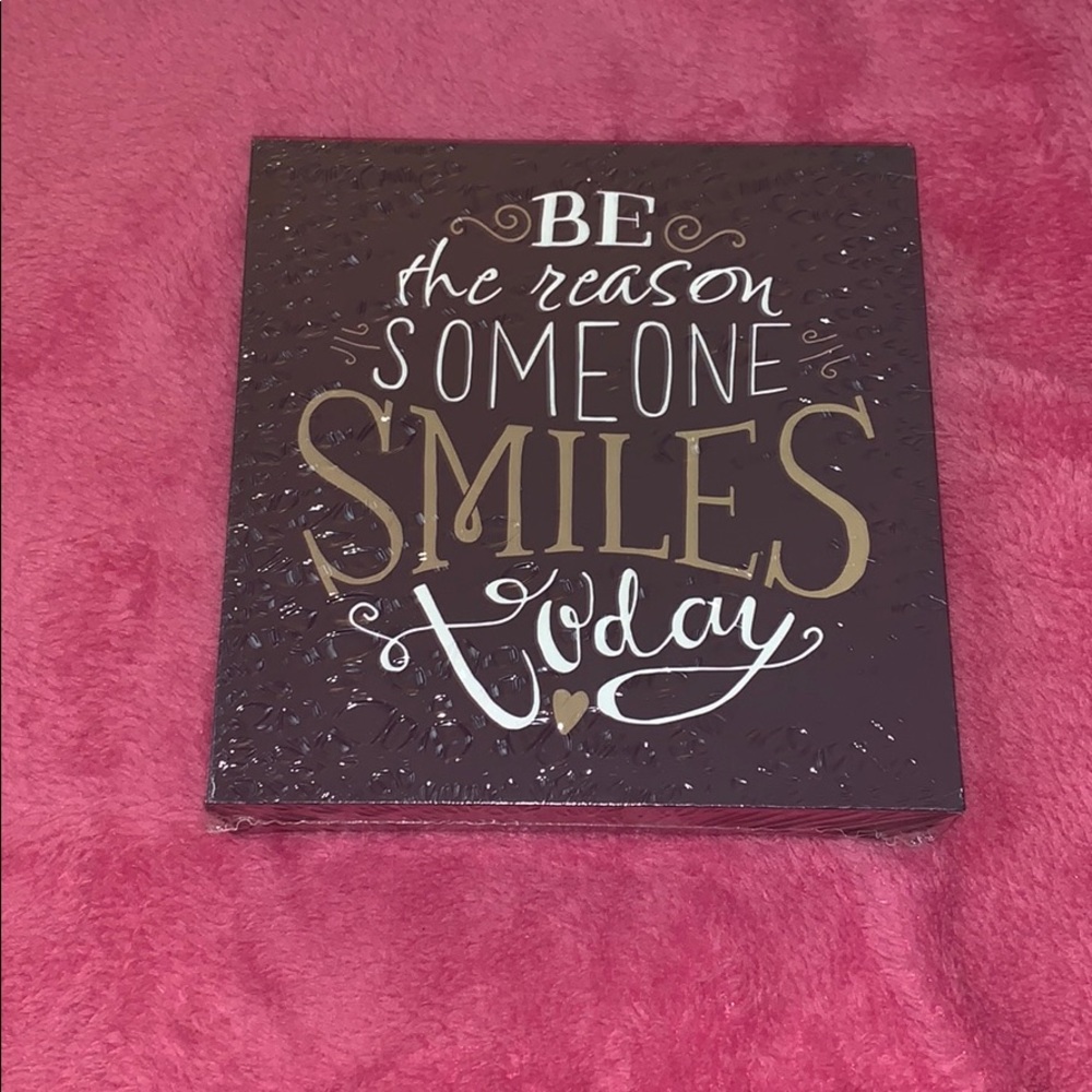“Be the reason someone smiles today” wooden sign